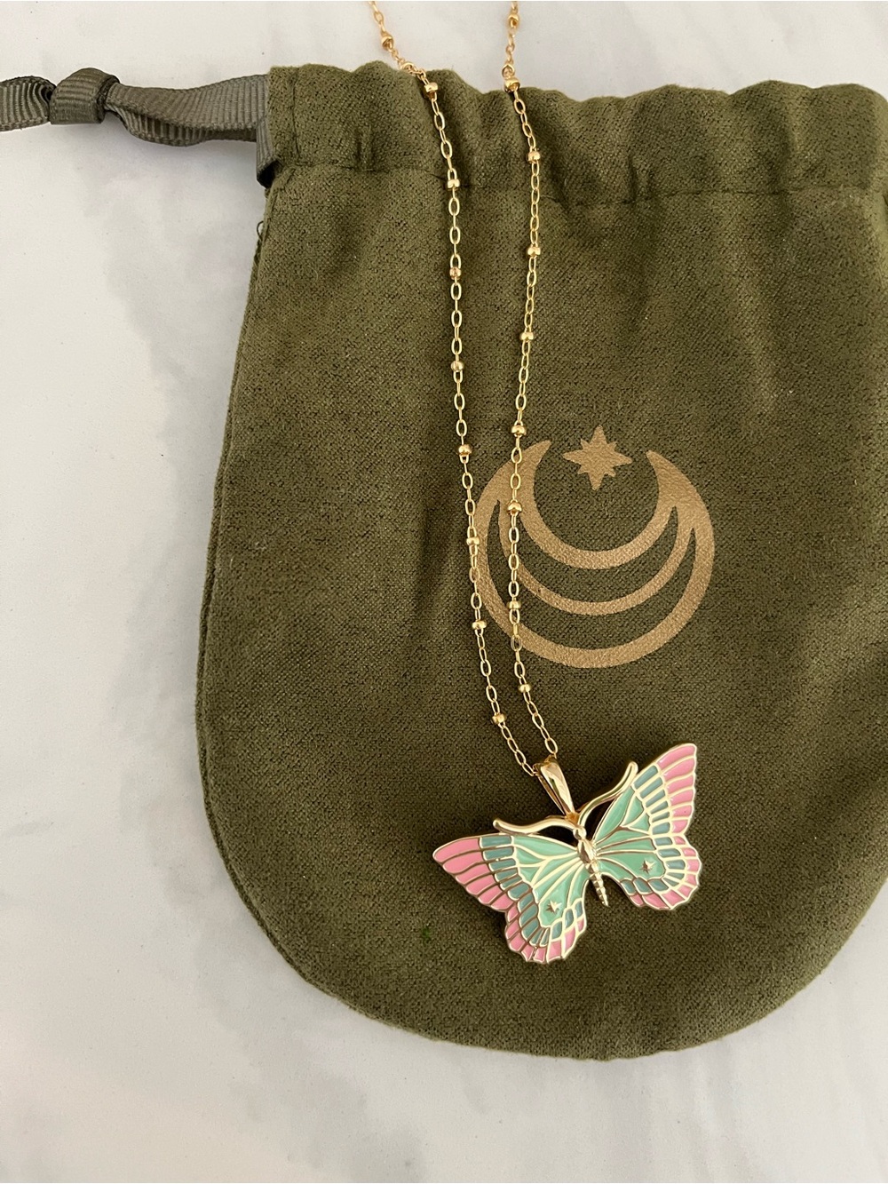 Jane Win pink and green enamel butterfly necklace.